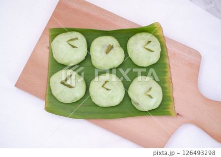 steamed glutinous rice cake on wooden plate 126493298