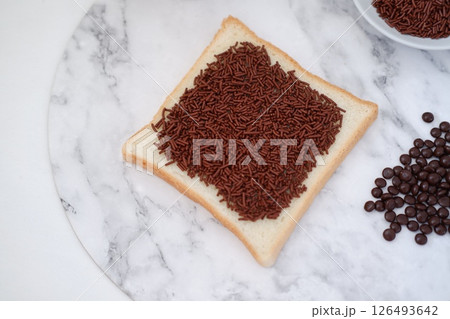 Sandwich with chocolate and coffee on a wooden board, stock photo 126493642