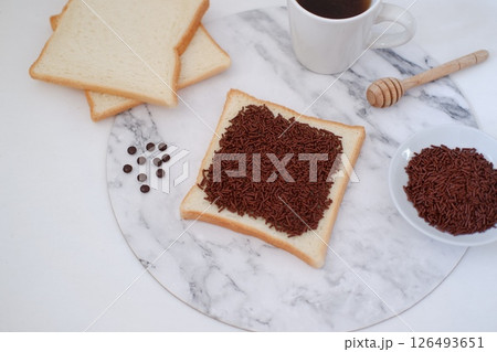 Sandwich with chocolate and coffee on a wooden board, stock photo 126493651
