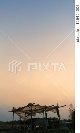Cemara Beach Twilight with Coastal Shelter 126494005