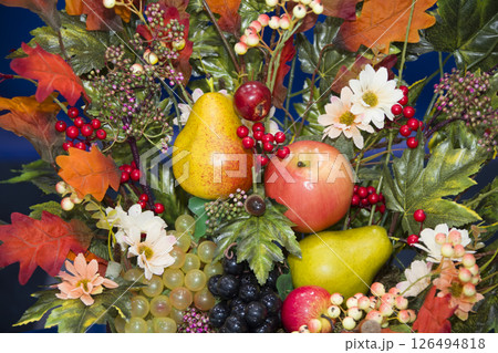 Autumn background of yellow leaves, apples, pears and grapes. Autumn still life Autumn background of yellow leaves, apples, pears and grapes. Autumn still life 126494818