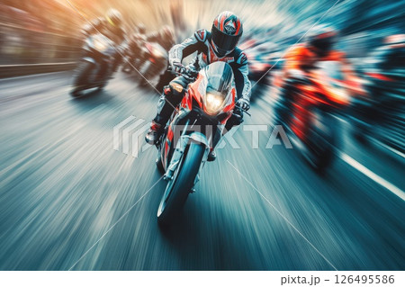 A man on a motorcycle is in the middle of a race with other motorcycles A man on a motorcycle is in the middle of a race with other motorcycles 126495586