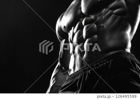 Close-Up of Male Torso with Bulging Veins and Defined Muscles in Dramatic Lighting 126495589