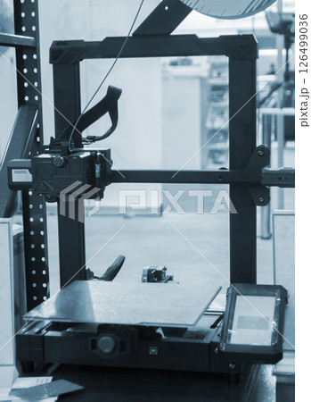 Empty working surface of 3D printer. 3D printer not working. Desktop 3D printer without printing process. 126499036