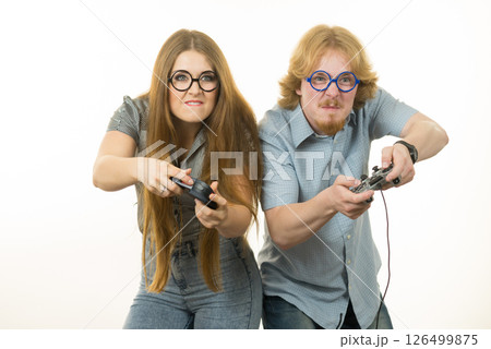 Gaming couple playing games Gaming couple playing games 126499875