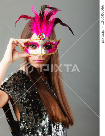 woman face with carnival mask on gray 126500066