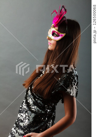 woman with carnival mask on gray woman with carnival mask on gray 126500068