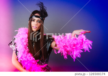 Girl pink plume and black feather on head. Carnival. Girl pink plume and black feather on head. Carnival. 126500174
