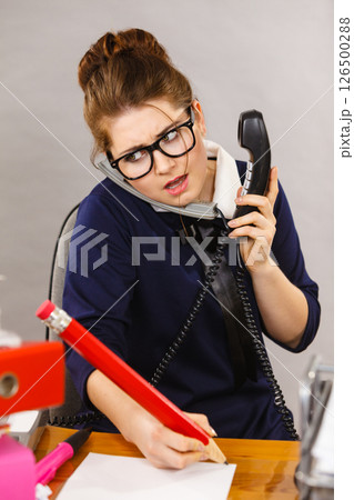 Sleepy business woman in office working Sleepy business woman in office working 126500288