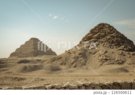 The pyramid of Djoser. Step Pyramid of Djoser and The pyramid complex of Userkaf in the Sahara desert in the Egypt The pyramid of Djoser. Step Pyramid of Djoser and The pyramid complex of Userkaf in the Sahara desert in the Egypt 126500611