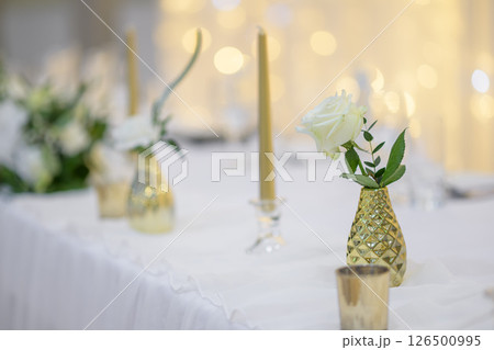 wedding table with exclusive floral arrangement prepared for reception, wedding or event centerpiece in greenery style wedding table with exclusive floral arrangement prepared for reception, wedding or event centerpiece in greenery style 126500995