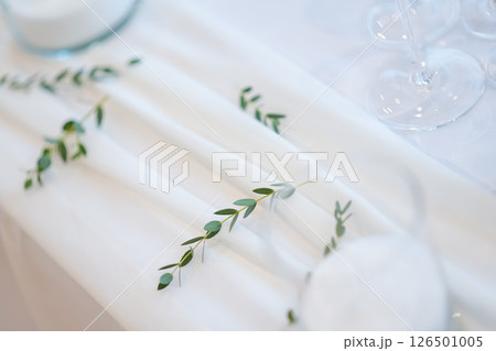 wedding table with exclusive floral arrangement prepared for reception, wedding or event centerpiece in greenery style 126501005