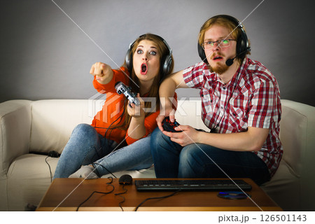 Gamer couple playing games Gamer couple playing games 126501143