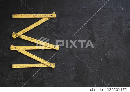 Yellow Measuring tape for tool roulette or ruler. Tape measure template in centimeters Yellow Measuring tape for tool roulette or ruler. Tape measure template in centimeters 126501175