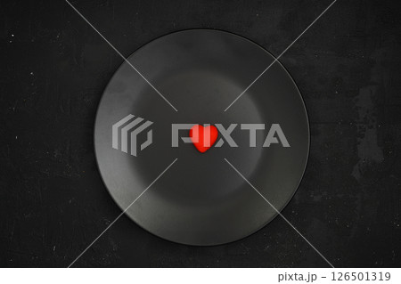 Creative concept food holiday valentines day love photo of heart on plate dish on black background. 126501319