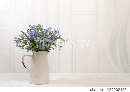 Abstract flower arrangement,Beautiful spring forget-me-not flowers in vase on light background,flyer. still life and template for design,floral holiday card and summer greeting concept, 126502185