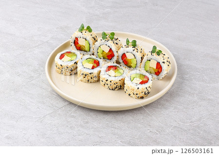 Sesame Coated Vegan Sushi Roll with Tofu Avocado Red Pepper Microgreens Sesame Coated Vegan Sushi Roll with Tofu Avocado Red Pepper Microgreens 126503161