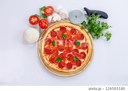 Enjoy a Delicious Pepperoni Pizza made with Fresh and HighQuality Ingredients and Tools 126503180