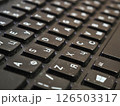 Keyboard covered in dust and debris, illustrating potential degradation from lack of routine cleaning and maintenance 126503317