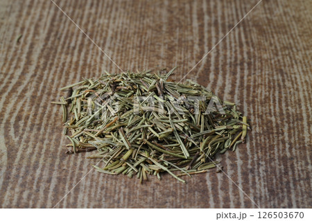 Dry organic background or texture of rosemary leaves. Healthy food concept . a wooden spoon with rosemary Dry organic background or texture of rosemary leaves. Healthy food concept . a wooden spoon with rosemary 126503670
