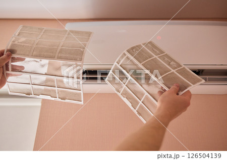 Performing regular cleaning of an Air Conditioner Filter can significantly enhance its efficiency Performing regular cleaning of an Air Conditioner Filter can significantly enhance its efficiency 126504139