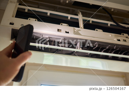 Performing regular cleaning of an Air Conditioner Filter can significantly enhance its efficiency 126504167