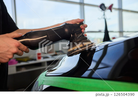 A Detailed Close Up of the Car Polishing Process in the Field of Automotive Detailing 126504390