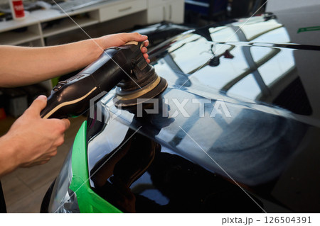 A Detailed Close Up of the Car Polishing Process in the Field of Automotive Detailing 126504391