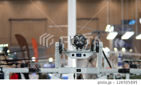 A drone featuring advanced surveillance equipment is showcased at a military expo, highlighting innovations in modern warfare and defense strategies. A drone featuring advanced surveillance equipment is showcased at a military expo, highlighting innovations in modern warfare and defense strategies. 126505895