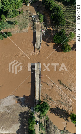 Aerial view of small bridge in Mae Yao district of Chiang Rai province collapsed after typhoon Yagi swept across Thailand. 126508501