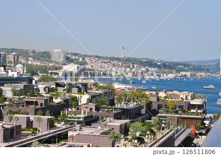 Istanbul, Turkey - Galataport waterfront in Karakoy with a view of the city skyline from abstract cruise ship Istanbul, Turkey - Galataport waterfront in Karakoy with a view of the city skyline from abstract cruise ship 126511806