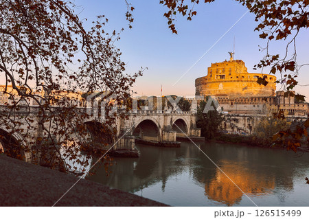 Rome in morning. Panoramic view of Castel Sant'Angelo and Bridge in Rome with reflection in Tiber river. Rome in morning. Panoramic view of Castel Sant'Angelo and Bridge in Rome with reflection in Tiber river. 126515499
