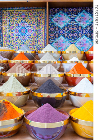 Traditional spices market. Pots and wooden tubs stand in row with colorful tea, spices, fruits, roots, flowers. Street bazaar. Dubai, UAE. Vertical photo Traditional spices market. Pots and wooden tubs stand in row with colorful tea, spices, fruits, roots, flowers. Street bazaar. Dubai, UAE. Vertical photo 126515501