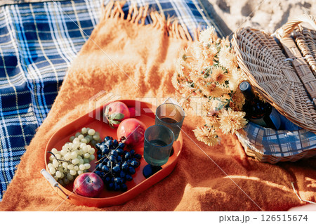 Portrait happy beautiful couple in love enjoying autumn picnic in autumn park. Vertical photo. High quality photo Portrait happy beautiful couple in love enjoying autumn picnic in autumn park. Vertical photo. High quality photo 126515674