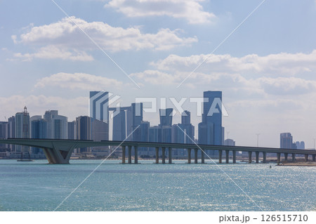 View of city with towers and skyscrapers from Saadiyat Island in Abu Dhabi, United Arab Emirates. View from water surface. High quality photo 126515710