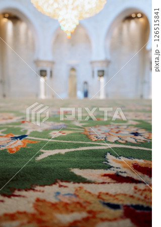 View of Sheikh Zayed Grand Mosque in Abu Dhabi. Inside mosque with famous huge seamless carpet. Vertical photo 126515841