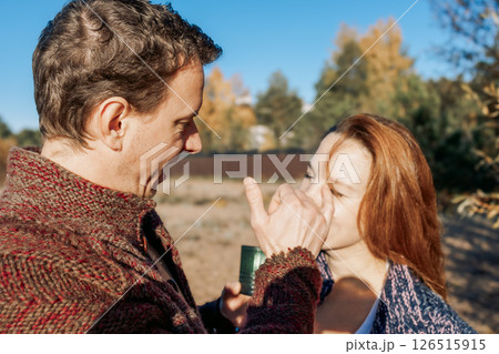 Happy beautiful couple in love enjoying autumn picnic in autumn park. Weekend and lifestyle concept. High quality photo 126515915