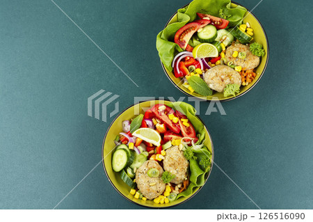 Vegetable Buddha Bowls with Fish cutlets. 126516090