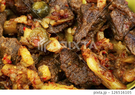 Meat stew made from beef with potatoes and pickles. 126516105