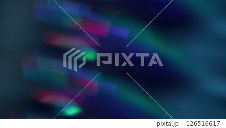 Blurred light flash. Crystal flare lens. Multicolor blue pink green kaleidoscope background with bokeh effect. 126516617