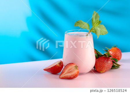 Strawberry yogurt and fresh berries on a colorful background. Strawberry yogurt and fresh berries on a colorful background. 126518524