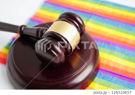 Gavel for judge lawyer on rainbow flag, symbol of LGBT pride month. 126520657
