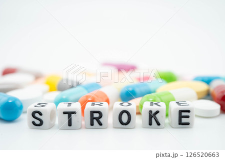 Stroke word with pills and capsules medical drug. 126520663