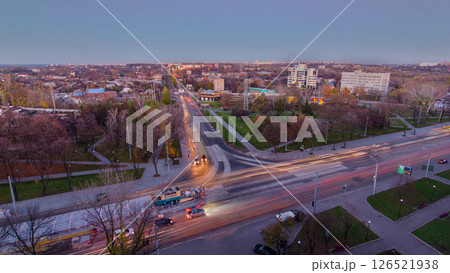 Road intersection with reconstructed tram tracks aerial panoramic day to night timelapse. Road intersection with reconstructed tram tracks aerial panoramic day to night timelapse. 126521938