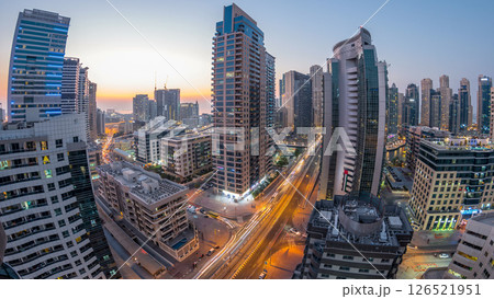 Aerial view of Dubai Marina after sunset from a vantage point day to night timelapse. Aerial view of Dubai Marina after sunset from a vantage point day to night timelapse. 126521951