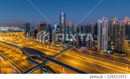 Dubai Marina skyscrapers aerial top view before sunrise from JLT in Dubai night to day timelapse, UAE. 126521973