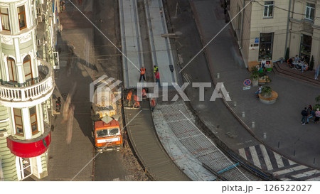 Concrete works for road maintenance construction with many workers and mixer machine timelapse 126522027