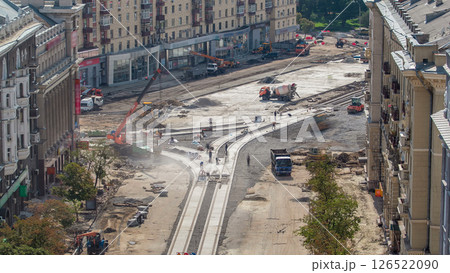 Concrete works for road construction with many workers and mixer timelapse 126522090