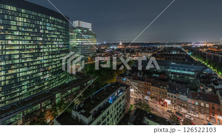 Aerial night timelapse of Brussels urban landscape blending office skyscrapers with residential areas. 126522103