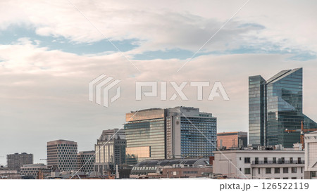Aerial timelapse of modern skyscrapers and towers in Brussels with glass facades reflecting cloudy sky. Belgium Aerial timelapse of modern skyscrapers and towers in Brussels with glass facades reflecting cloudy sky. Belgium 126522119